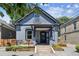 Charming gray two-story home with inviting front porch and landscaped yard at 1519 E 29Th Ave, Denver, CO 80205