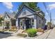 Charming gray two-story home with landscaped front yard and inviting porch at 1519 E 29Th Ave, Denver, CO 80205
