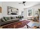Bright living room with hardwood floors, modern fireplace, and large painting on the wall at 1519 E 29Th Ave, Denver, CO 80205