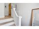 Elegant staircase with white railings and light wood steps, leading to the upper level at 1519 E 29Th Ave, Denver, CO 80205