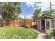 Landscaped backyard with well-manicured lawn and charming shed at 3325 Irving St, Denver, CO 80211