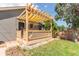 This cozy pergola-covered deck provides shade and space for outdoor relaxation at 3325 Irving St, Denver, CO 80211