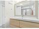 Modern bathroom featuring a sleek vanity with mirror and shower/tub combo at 3325 Irving St, Denver, CO 80211