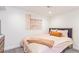 Bedroom featuring modern furnishings, plush bedding, and soft lighting at 3325 Irving St, Denver, CO 80211