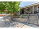 Charming home with an inviting front yard with a retaining wall and comfortable porch seating at 3325 Irving St, Denver, CO 80211