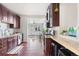 Modern kitchen featuring granite countertops, stainless steel appliances, and convenient breakfast bar at 3438 N York St, Denver, CO 80205