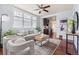 Bright living room with large windows, hardwood floors, modern furnishings, and stylish decor at 3438 N York St, Denver, CO 80205