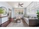 Cozy living room with a grey sofa, elegant rug, and natural light from the windows at 3438 N York St, Denver, CO 80205