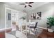 Cozy office features a white desk, modern art, and a striped rug, creating a stylish workspace at 3438 N York St, Denver, CO 80205