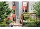 The backyard features a private outdoor space with a pergola, seating, and vibrant greenery at 377 Pearl St # 5, Boulder, CO 80302
