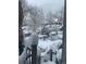 Balcony view of winter wonderland with snow-covered trees and railings at 377 Pearl St # 5, Boulder, CO 80302