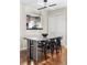 Bright dining area has modern table set, stylish lighting, and hardwood floors at 377 Pearl St # 5, Boulder, CO 80302