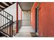 Hallway view with the unit number on the building's red exterior at 377 Pearl St # 5, Boulder, CO 80302
