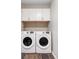 A laundry room featuring Samsung washer and dryer with upper storage cabinets at 377 Pearl St # 5, Boulder, CO 80302