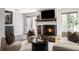 Spacious living room with a fireplace, comfortable seating, and a unique slate tile entryway at 377 Pearl St # 5, Boulder, CO 80302