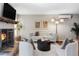 Comfortable living room with stylish furniture, fireplace, and bright natural light from multiple windows at 377 Pearl St # 5, Boulder, CO 80302