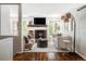 Inviting living room with a cozy fireplace, hardwood floors, and stylish contemporary furnishings at 377 Pearl St # 5, Boulder, CO 80302
