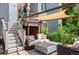 Relaxing backyard patio featuring an outdoor seating area, shade pergola, and well-manicured landscaping at 377 Pearl St # 5, Boulder, CO 80302