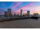 Wide shot of the balcony with a skyline view at sunset at 2001 Lincoln St # 2524, Denver, CO 80202