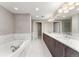 Elegant bathroom showcasing marble accents, double sinks, and a modern lighting fixture at 2001 Lincoln St # 2524, Denver, CO 80202