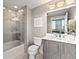 Bathroom with a shower-tub combination, marble countertop vanity, and modern fixtures at 2001 Lincoln St # 2524, Denver, CO 80202