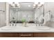 Modern bathroom with double sinks, marble countertops, and stylish lighting at 2001 Lincoln St # 2524, Denver, CO 80202