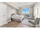 Cozy bedroom with a large window offering stunning city views and comfortable seating at 2001 Lincoln St # 2524, Denver, CO 80202