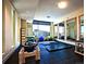 Gym equipped with pilates reformer, mats, fitness balls, mirrors and city views at 2001 Lincoln St # 2524, Denver, CO 80202