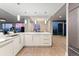 Modern kitchen featuring marble countertops, stainless steel appliances, and an open concept layout with views of the city skyline at 2001 Lincoln St # 2524, Denver, CO 80202