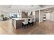Open-concept kitchen with a large island, modern appliances, and hardwood floors at 2001 Lincoln St # 2524, Denver, CO 80202