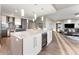 Modern kitchen featuring a wine refrigerator, large island, and stainless appliances at 2001 Lincoln St # 2524, Denver, CO 80202