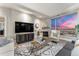 Inviting living room featuring a fireplace, city views through large windows, and sophisticated furnishings at 2001 Lincoln St # 2524, Denver, CO 80202
