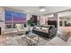 Cozy living room with a large window providing city views, comfortable seating, and stylish decor at 2001 Lincoln St # 2524, Denver, CO 80202