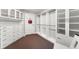 Spacious walk-in closet with custom shelving, drawers, and ample storage space at 2001 Lincoln St # 2524, Denver, CO 80202