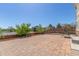 Large brick patio with trees and partial fence in a spacious backyard at 1226 S Fulton St, Aurora, CO 80247
