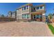 Spacious backyard featuring a large stone patio, swing, and outdoor dining area, complete with stone accent at 1226 S Fulton St, Aurora, CO 80247