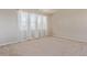 Empty bedroom with carpet, window and white trim at 1226 S Fulton St, Aurora, CO 80247