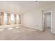 Spacious bedroom with carpet, white walls, windows and lots of natural light at 1226 S Fulton St, Aurora, CO 80247