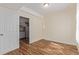 Empty bedroom featuring laminated floors and open layout at 1226 S Fulton St, Aurora, CO 80247