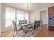 Dining room with a modern table setting and lots of natural light through large windows at 1226 S Fulton St, Aurora, CO 80247