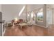 Bright living room with high ceilings and hardwood floors, filled with natural light at 1226 S Fulton St, Aurora, CO 80247
