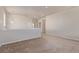 Open loft area with neutral paint, neutral carpet, and good lighting at 1226 S Fulton St, Aurora, CO 80247