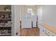 Kitchen pantry with ample shelving and storage space next to the refrigerator and extra counter at 1226 S Fulton St, Aurora, CO 80247