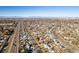 Expansive aerial view of suburban neighborhood with mountains in the distance at 1315 N Alton St, Aurora, CO 80010