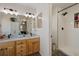 Spa-like bathroom with double vanity, shower, and soaking tub at 16935 Buffalo Valley Path, Monument, CO 80132