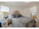 King-size bed, window, and ensuite bathroom access at 16935 Buffalo Valley Path, Monument, CO 80132