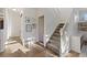 Bright entryway with hardwood floors and staircase at 16935 Buffalo Valley Path, Monument, CO 80132