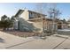 Side view of a two-story house with rock landscaping and a driveway at 16935 Buffalo Valley Path, Monument, CO 80132