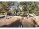 Two-story house with gray siding, landscaping, and a partially visible fence at 16935 Buffalo Valley Path, Monument, CO 80132