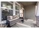 Covered front porch with a bench and potted plant at 16935 Buffalo Valley Path, Monument, CO 80132